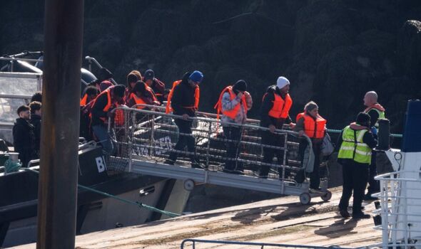 Border Force escorts migrants into Dover