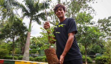 Guto Miguel plants a tree in Rio de Janeiro.