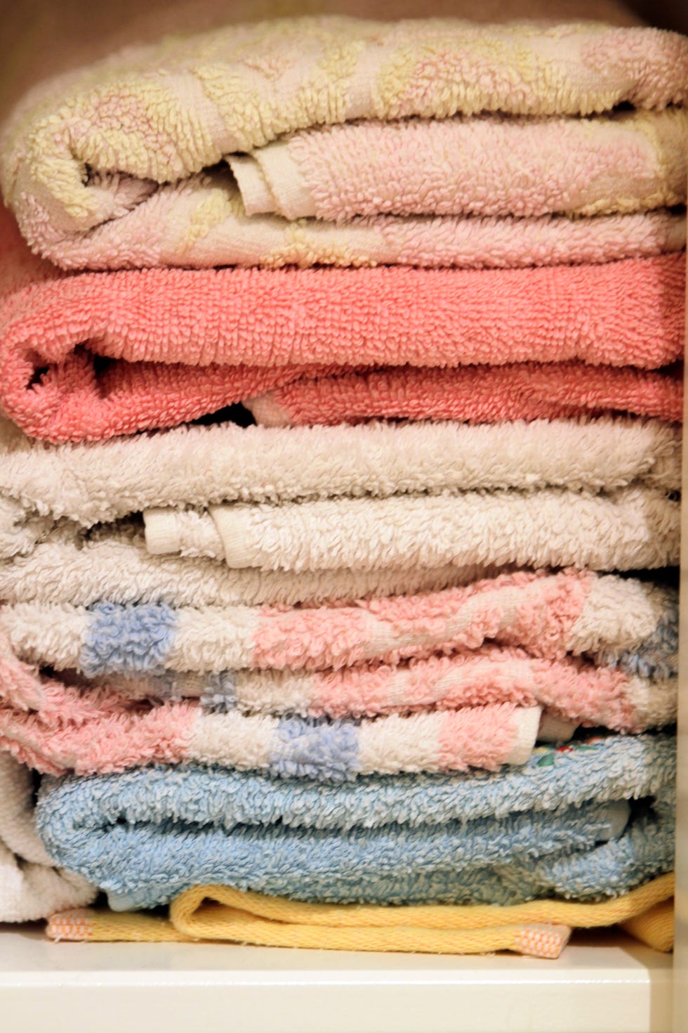 Old towels to help wildlife close up of stacked towels in cupboard