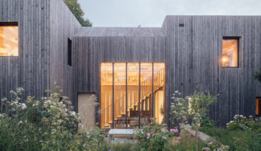 studio bark shapes 'orchard house' as two silvery larch-clad cubes