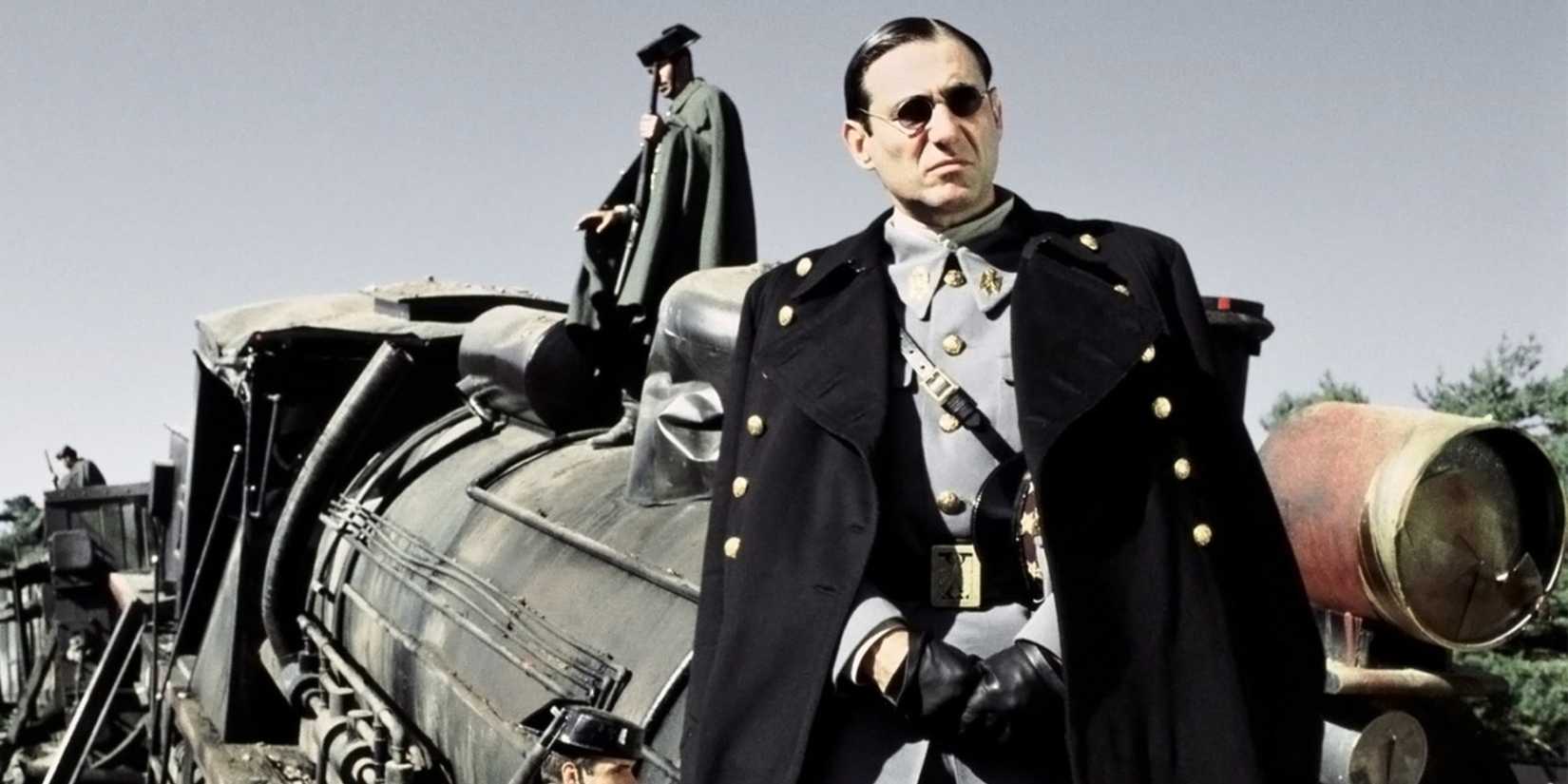 Captain Vidal looking ahead while standing in front of his car in Pan's Labyrinth - 2006