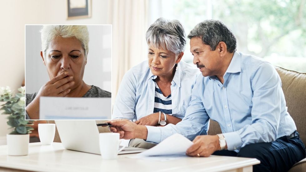 Pension warning - couple shocked at laptop