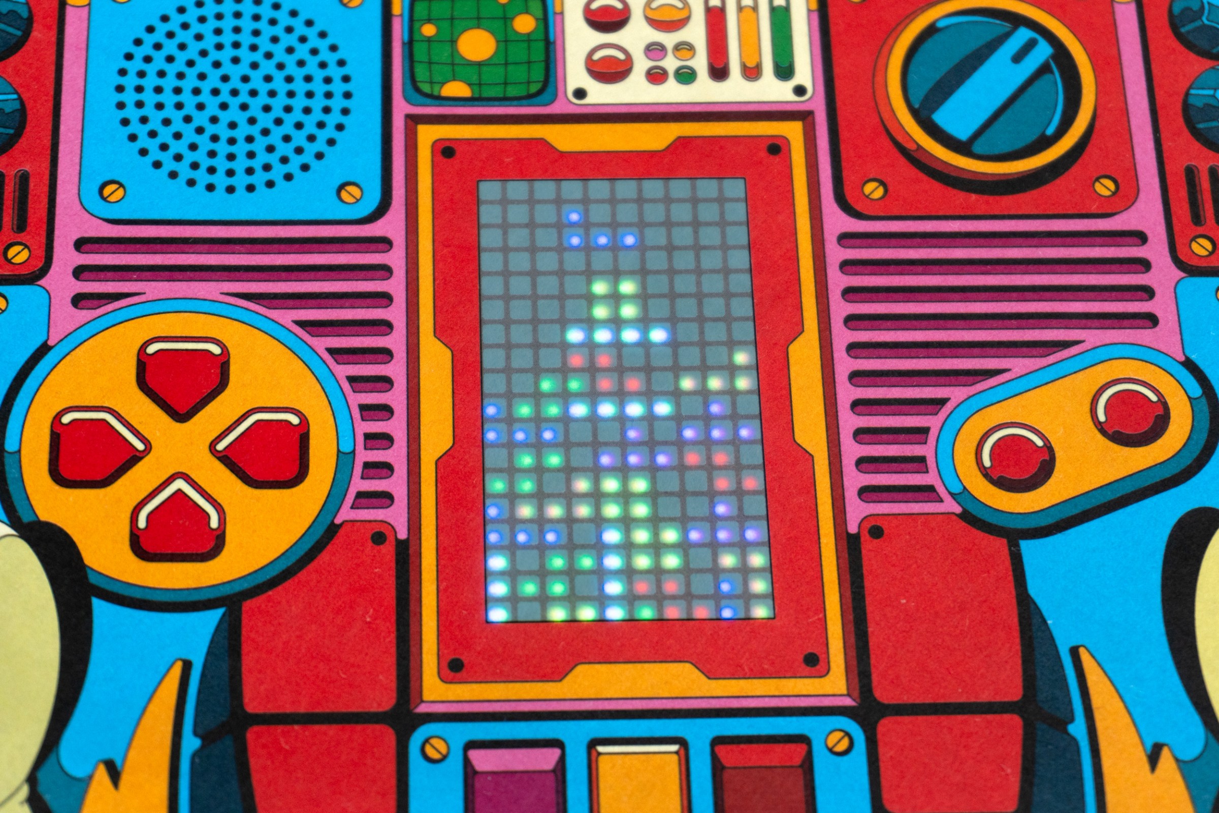 A close-up of the LED matrix screen on the front of the Red Bull GamePop magazine.