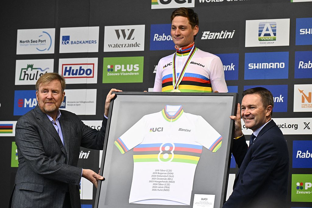 Dutch King Willem-Alexander and Dutch Mathieu van der Poel in the world champion jersey after winning for the eighth time the men elite race at UCI Cyclocross World Championships, on Sunday 01 February 2026, in Hulst, The Netherlands.BELGA PHOTO ERIC LALMAND (Photo by ERIC LALMAND / BELGA MAG / Belga via AFP)