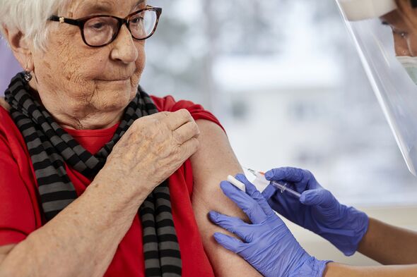 Senior woman getting covid vaccine
