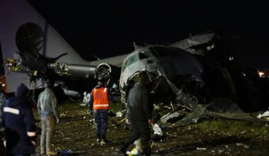 People at the scene where a plane crashed in El Alto, Bolivia. Pic: AP Photo/Juan Karita