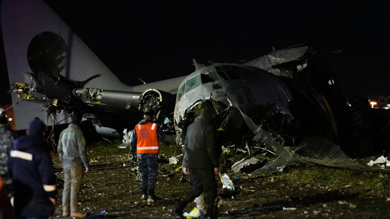 People at the scene where a plane crashed in El Alto, Bolivia. Pic: AP Photo/Juan Karita