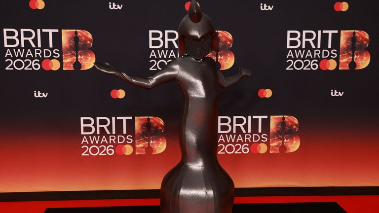 Even the Brit award itself got an invite to the red carpet! Pic: Reuters
