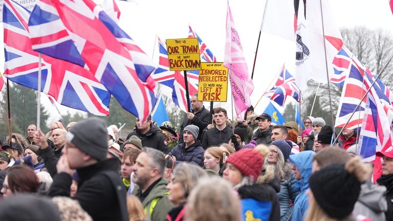 People take part in a protest in Crowborough after the first 27 illegal migrants were moved into Crowborough Training Camp. Pic: PA