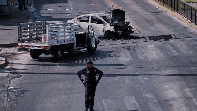 A charred vehicle in Guadalajara, Jalisco state. Pic: AP