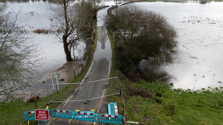 Floodwater covers a road near to Harbridge in Hampshire. Pic: PA