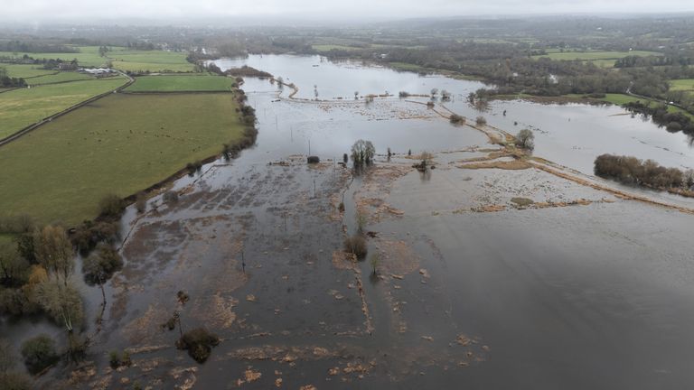 Floodwater cover fields near to Harbridge in Hampshire. Pic: PA