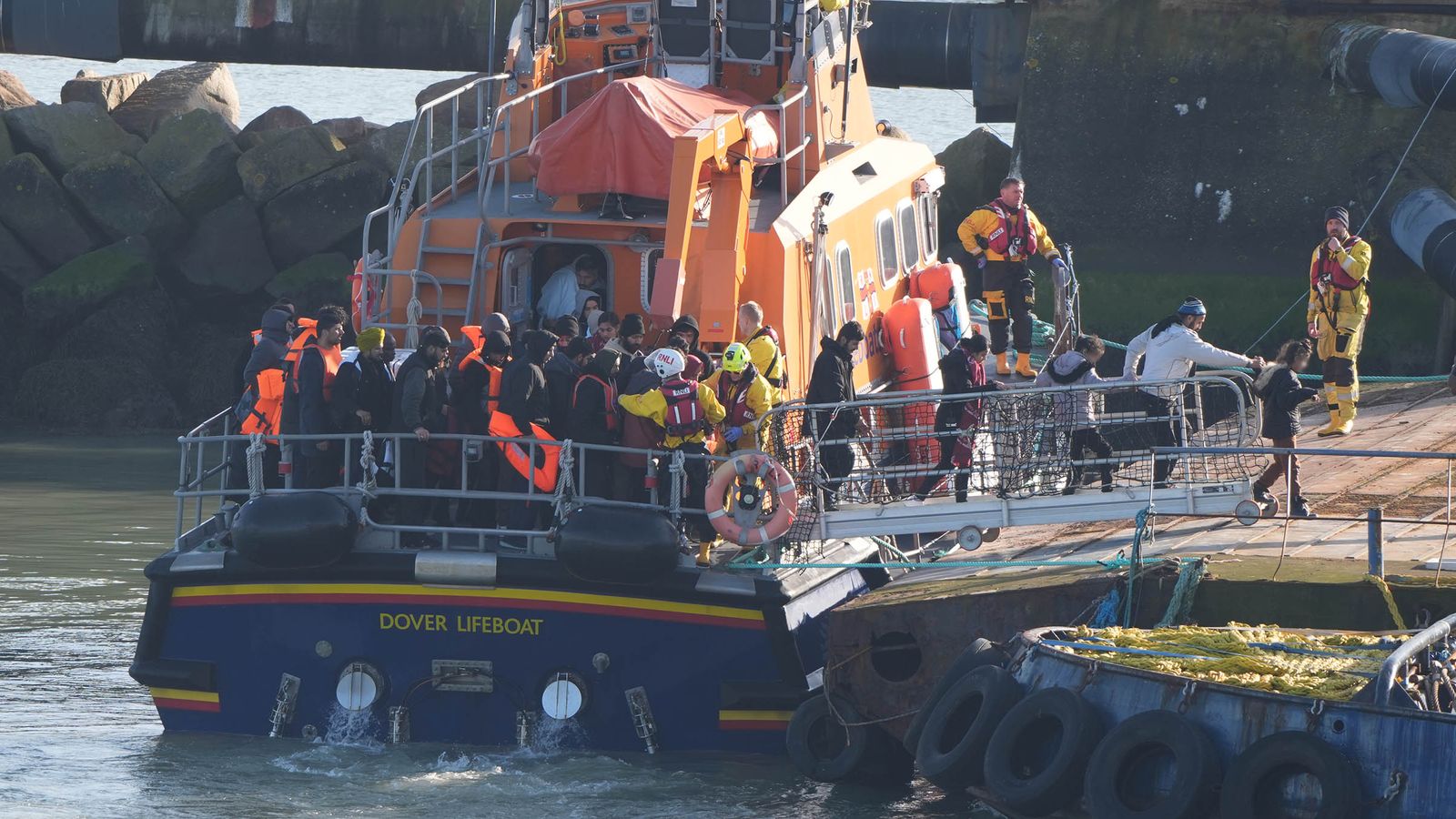 Migrants are brought ashore in Ramsgate, Kent, from the RNLI Dover lifeboat. Pic: PA