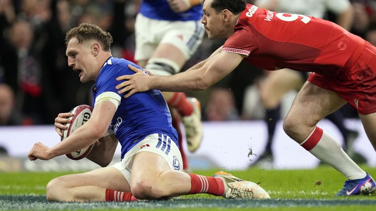 France's Emilien Gailleton (left) scores their sides first try of the game