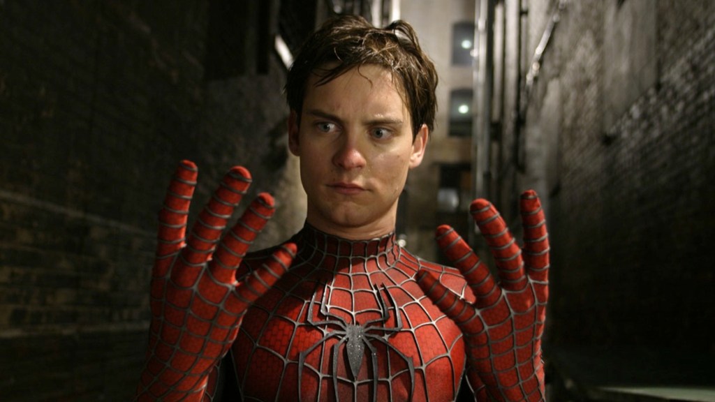 Tobey Maguire as Peter Parker looking at his hands in Spider-Man 2 (2004)