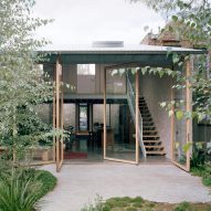 Cottage extension in Australia with rotating glass doors by Lovell Burton