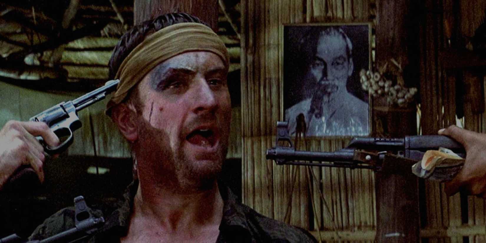 Michael holding a gun to his head while playing Russian Roulette in The Deer Hunter