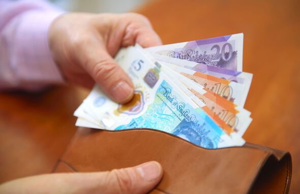 UK sterling, pound notes in wallet