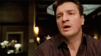 Nathan Fillion looking as though he's about to say something, then thinking better of it