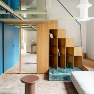 Glass floor and bookshelf staircase in RA House by StudioTamat
