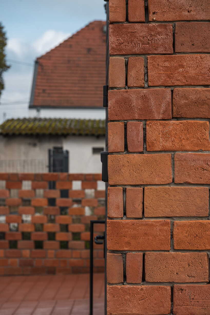 barrel-vaulted concrete cellar organizes vineyard building in poland
