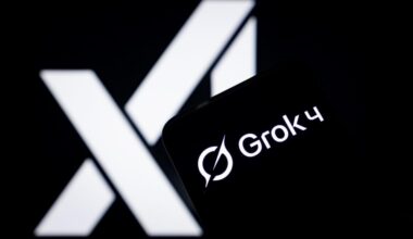 Photo illustration in which the logo of Grok 4 is displayed on a smartphone screen with the xAI logo in the background.