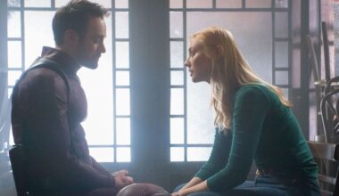 An unmasked Matt Murdock (Charlie Cox) sitting across from Karen Page (Deborah Ann Woll) in Daredevil: Born Again season 2