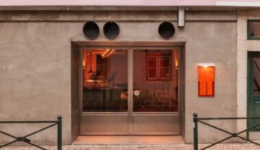 xxxi.studio divides lisbon restaurant with 15 m long wood counter