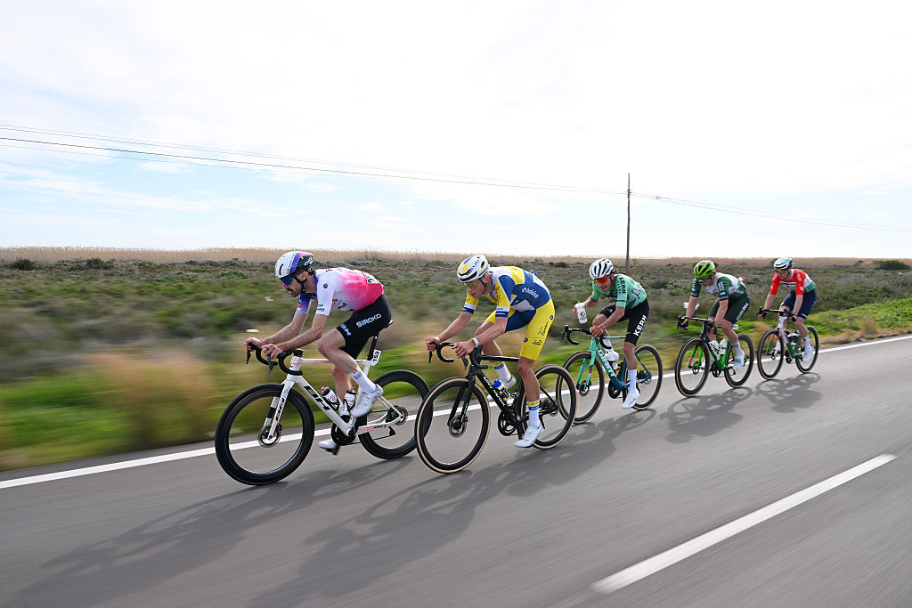 ROQUETAS DE MAR, SPAIN - FEBRUARY 15: (L-R) Ander Okamika of Spain and Team Burgos Burpellet BH, Brem Deman of Belgium and Team Flanders - Baloise, Pablo Carrascosa of Spain and Team Equipo Kern Pharma, Javier Ibanez of Spain and Team Caja Rural - Seguros RGA and Marton Dina of Hungary and Team MBH Bank CSB Telecom Fort compete in the breakaway during the 39th Clasica de Almeria 2026 a 189.7km one day race from Puebla de Vicar to Roquetas de Mar on February 15, 2026 in Roquetas de Mar, Spain. (Photo by Dario Belingheri/Getty Images)