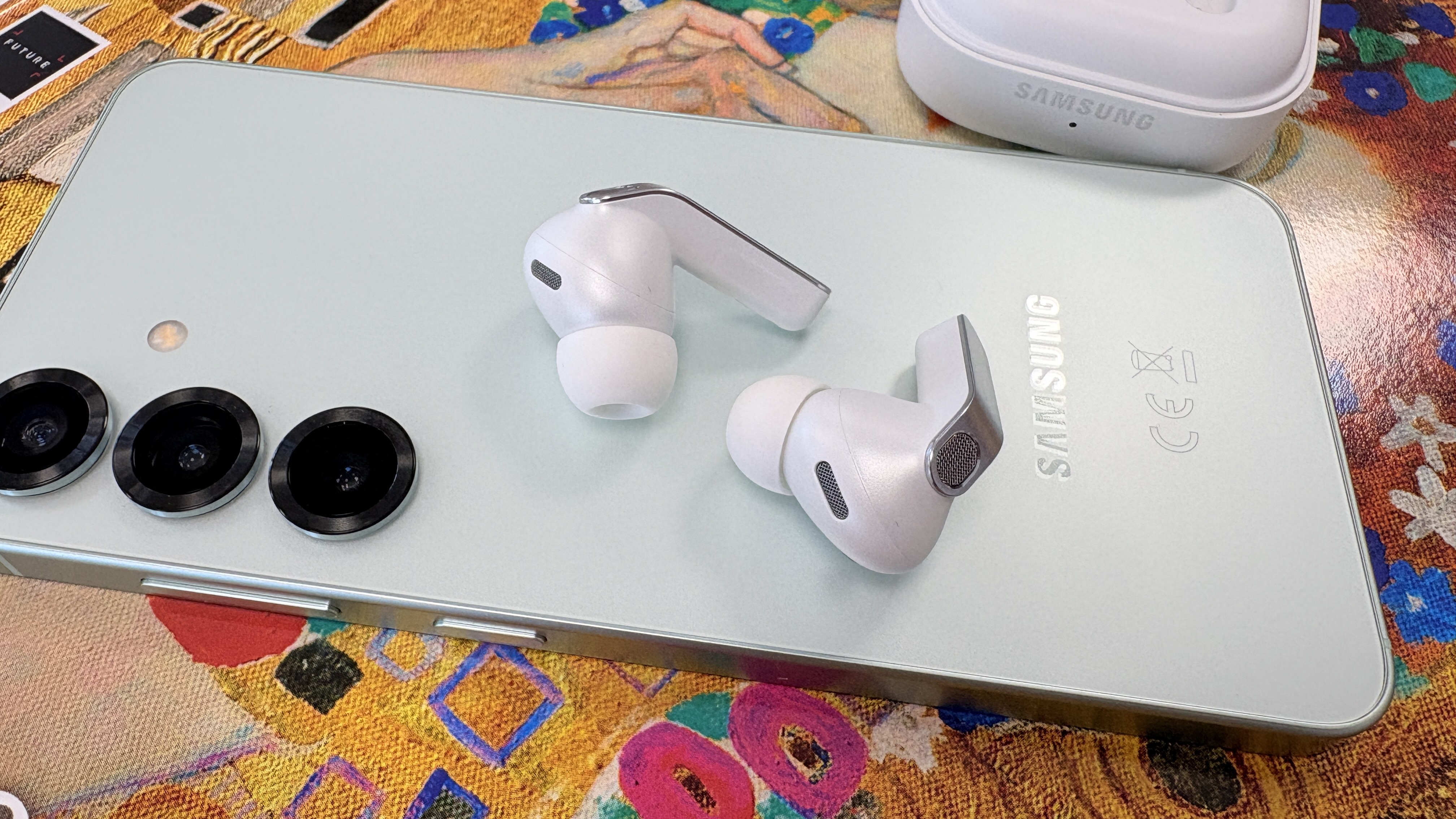 Samsung Galaxy Buds 4 Pro wireless earbuds in white finish with S25 smartphone