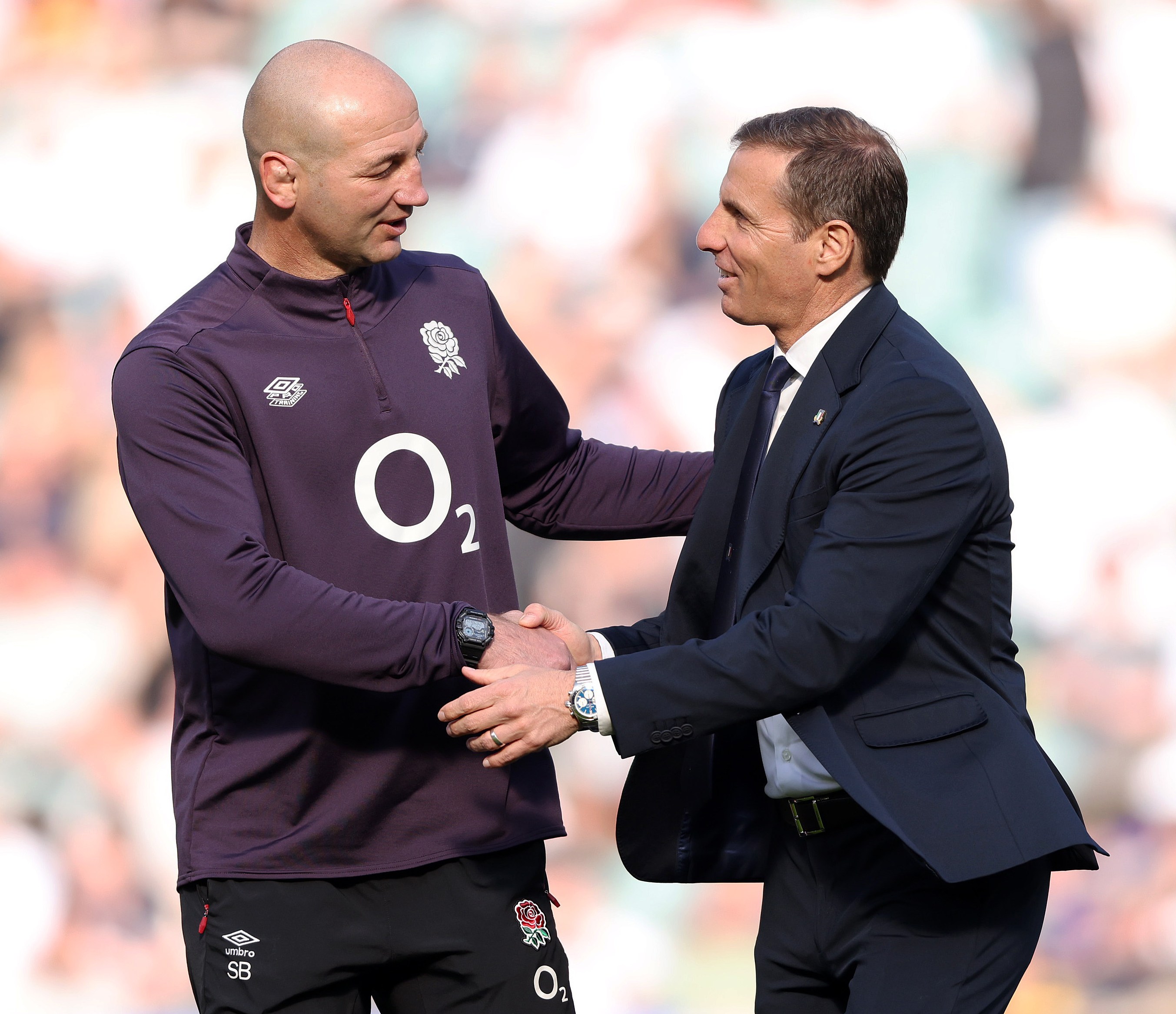 England Head Coach Steve Borthwick and Italy Head Coach Gonzalo Quesada shake hands.