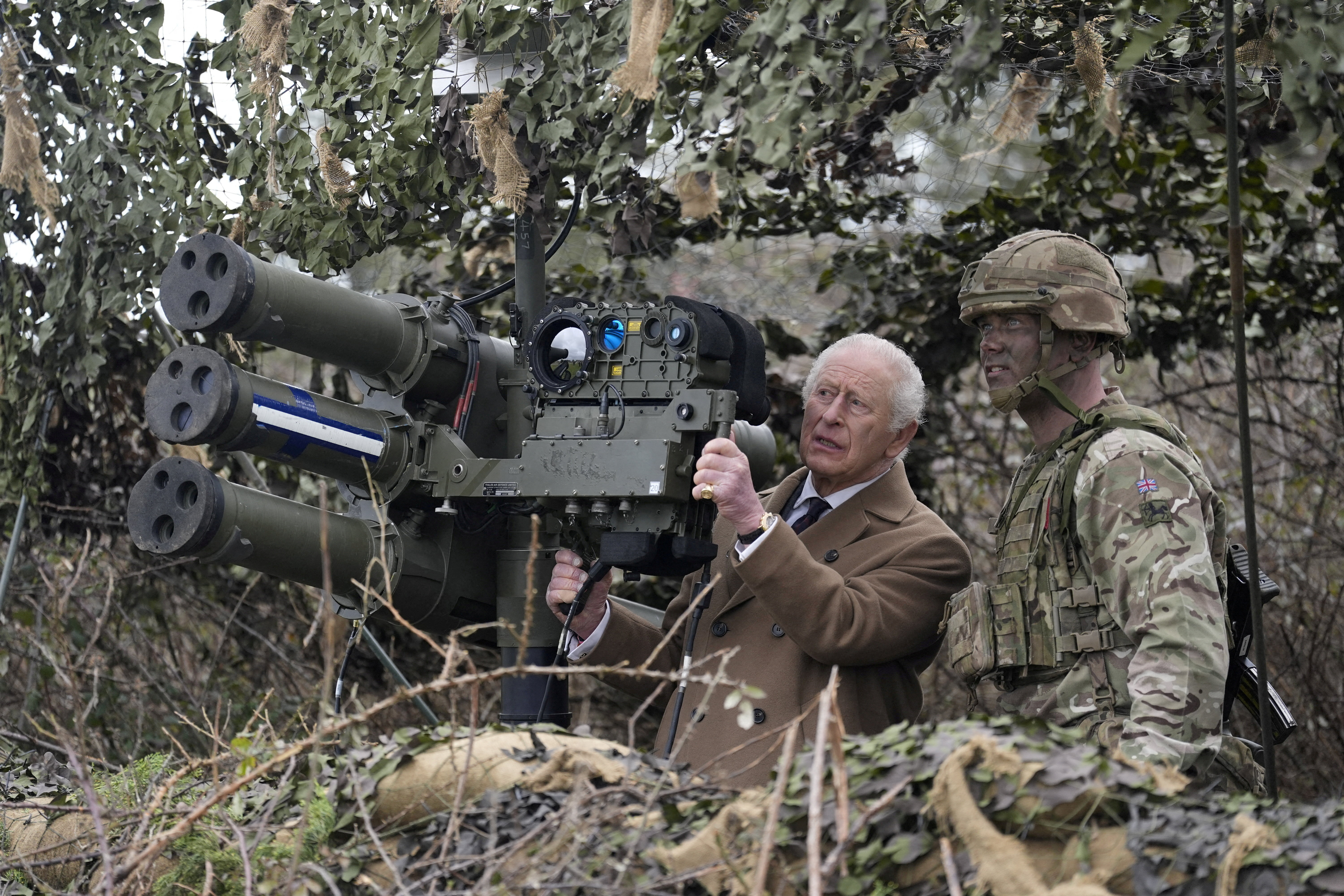 Britain's King Charles views a lightweight multiple launcher.