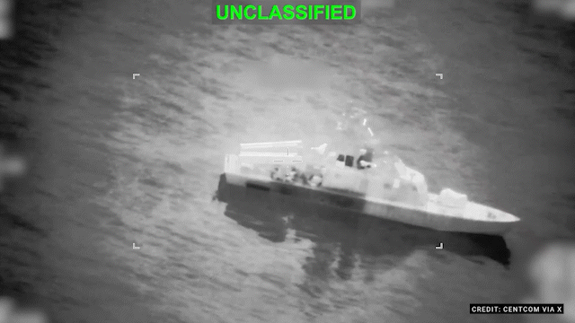 Night vision footage of a minelayer striking a mine, with "UNCLASSIFIED" written in green across the top.