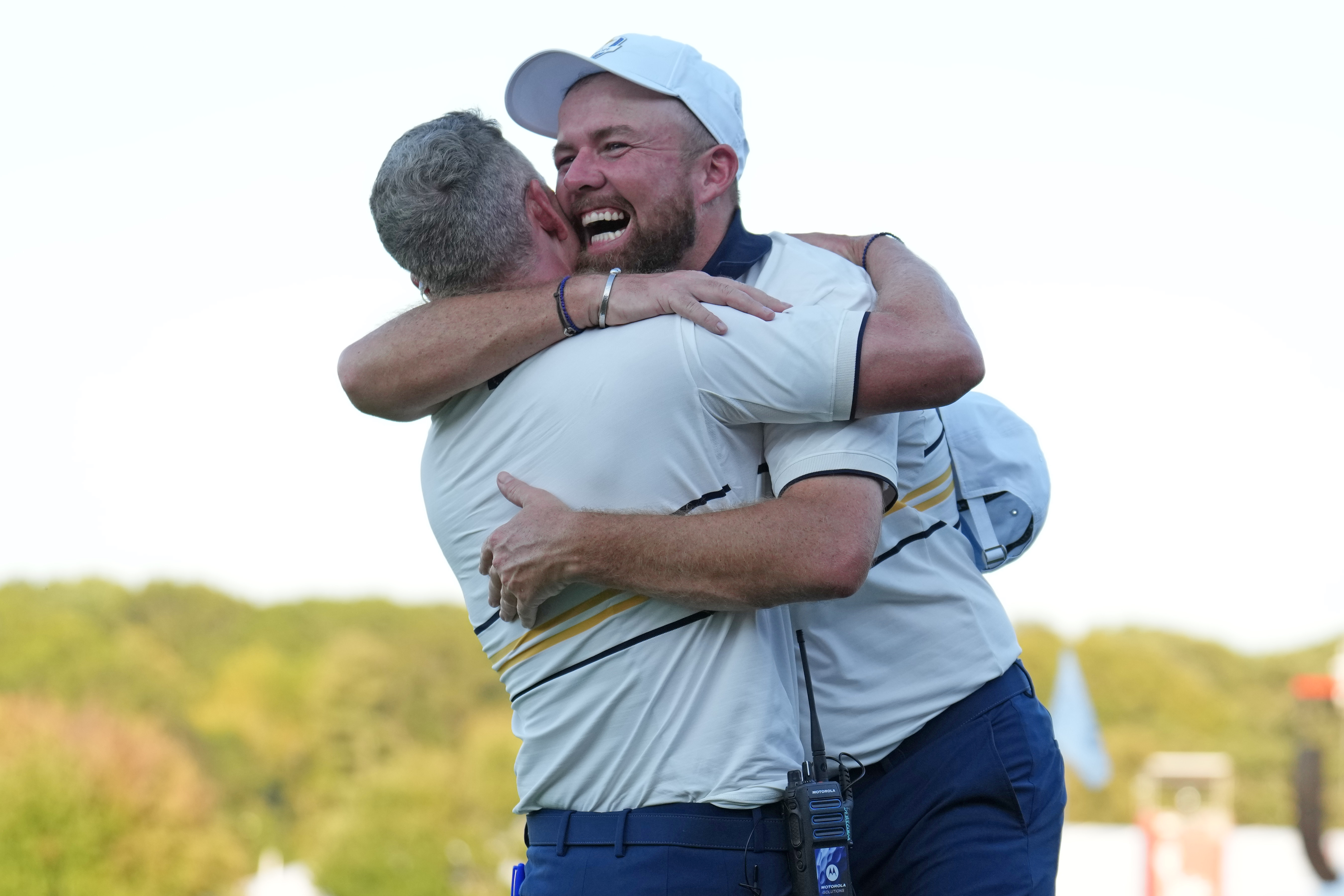 Luke Donald and Shane Lowry of Team Europe embrace after Lowry's putt in the Ryder Cup.
