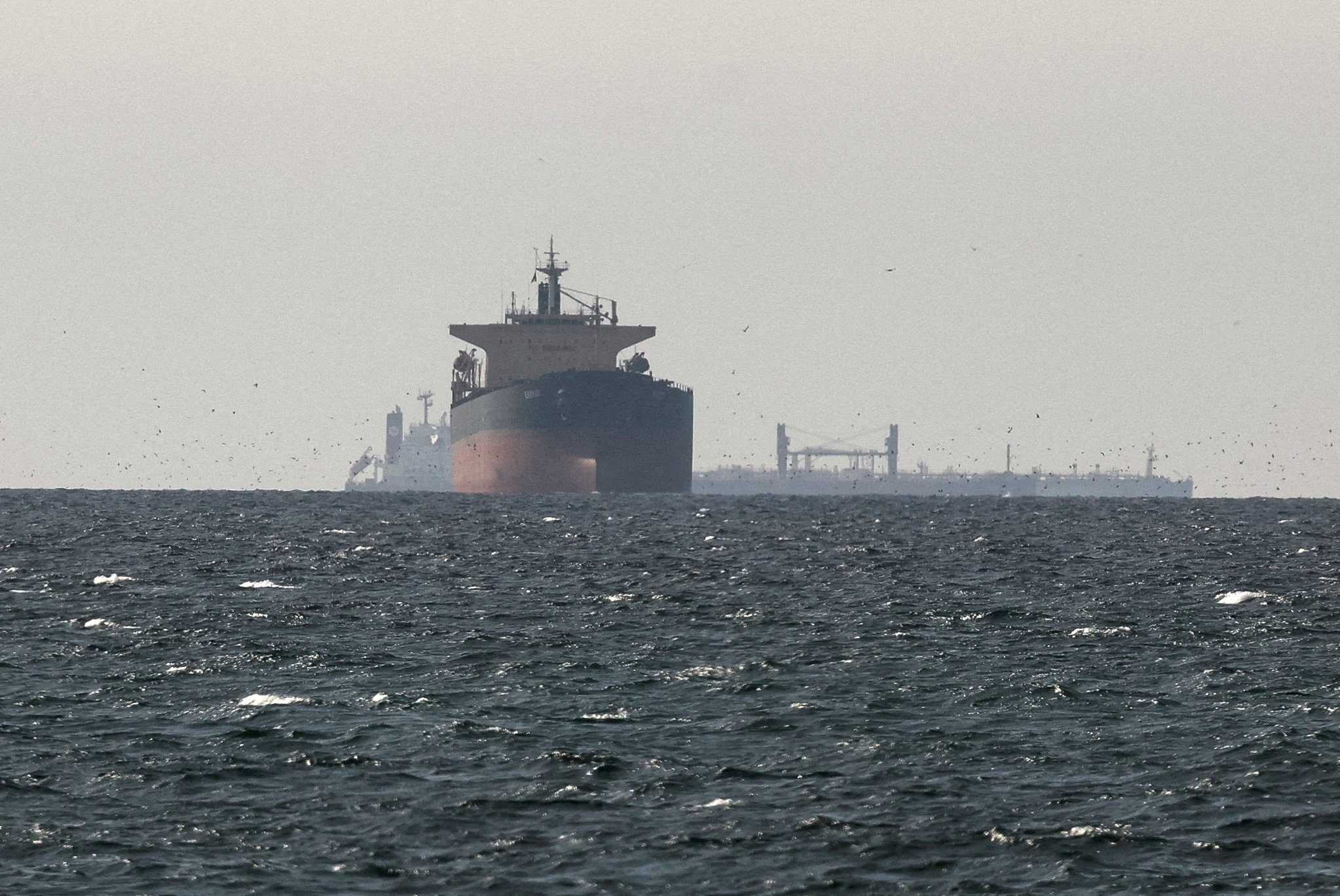 Cargo ships in the Gulf, near the Strait of Hormuz, as seen from northern Ras al-Khaimah, near the border with Oman’s Musandam governance.
