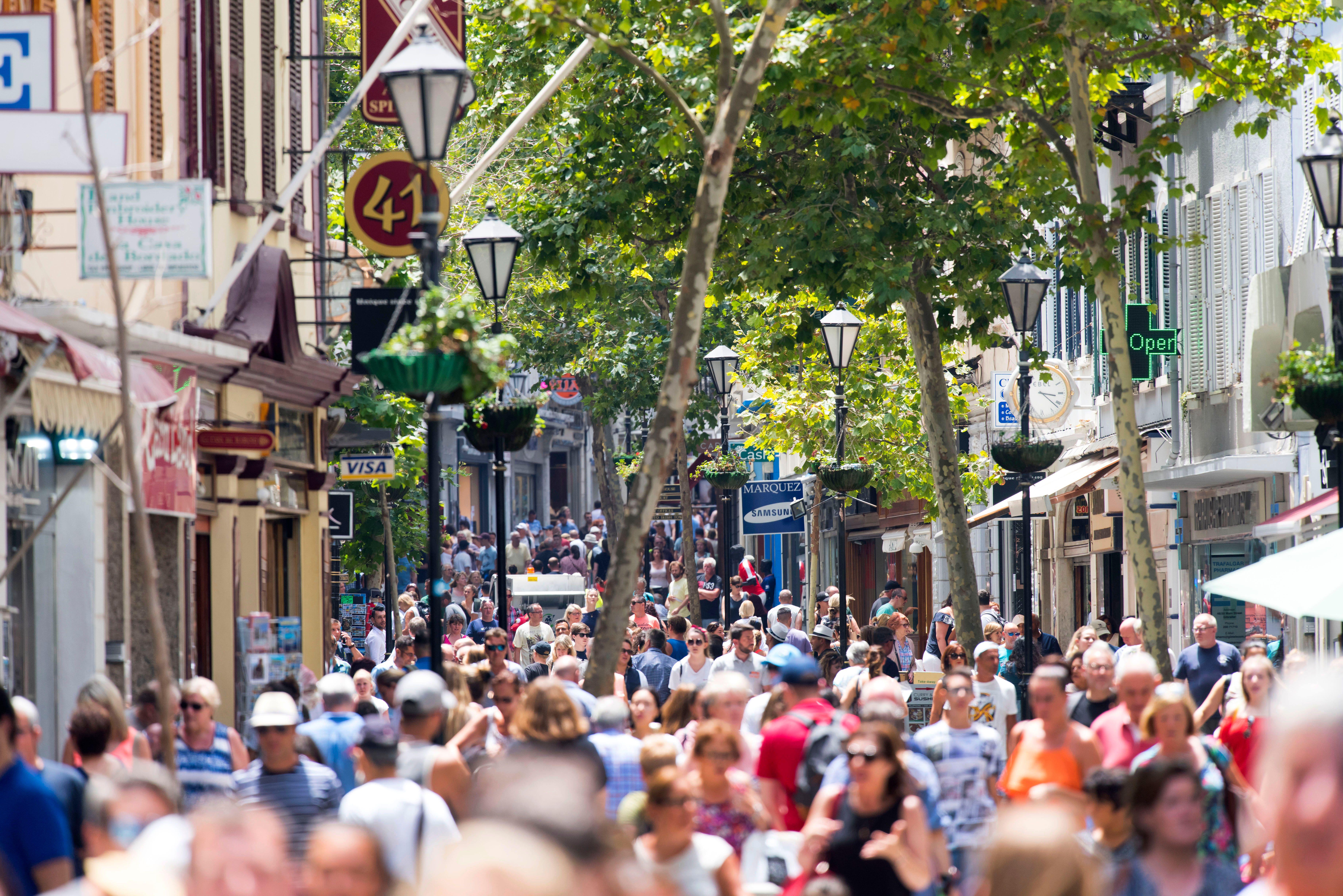 A general view of a busy Main Street in Gibraltar with many tourists.