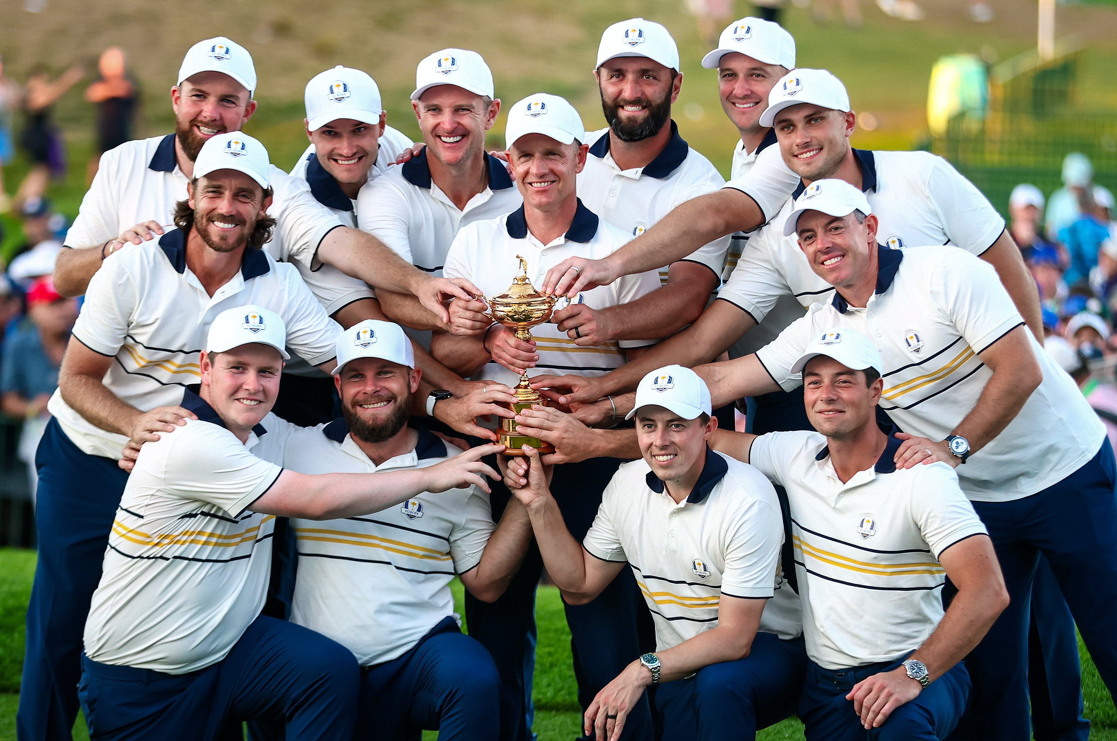 The Europe team and captain Luke Donald celebrate with the Ryder Cup.