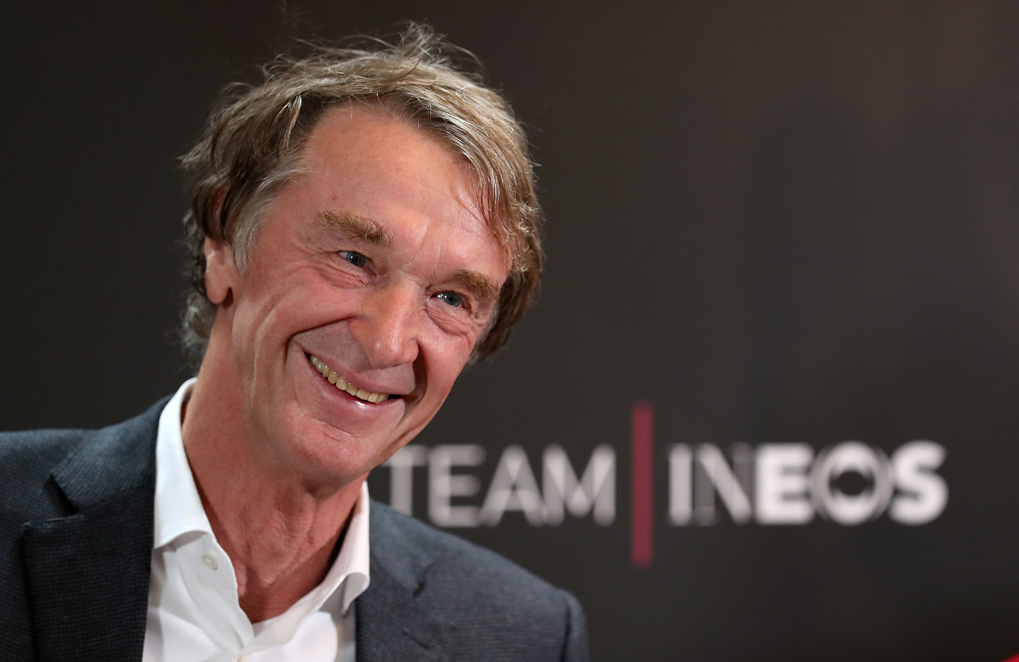 Team INEOS Owner Sir Jim Ratcliffe smiling.