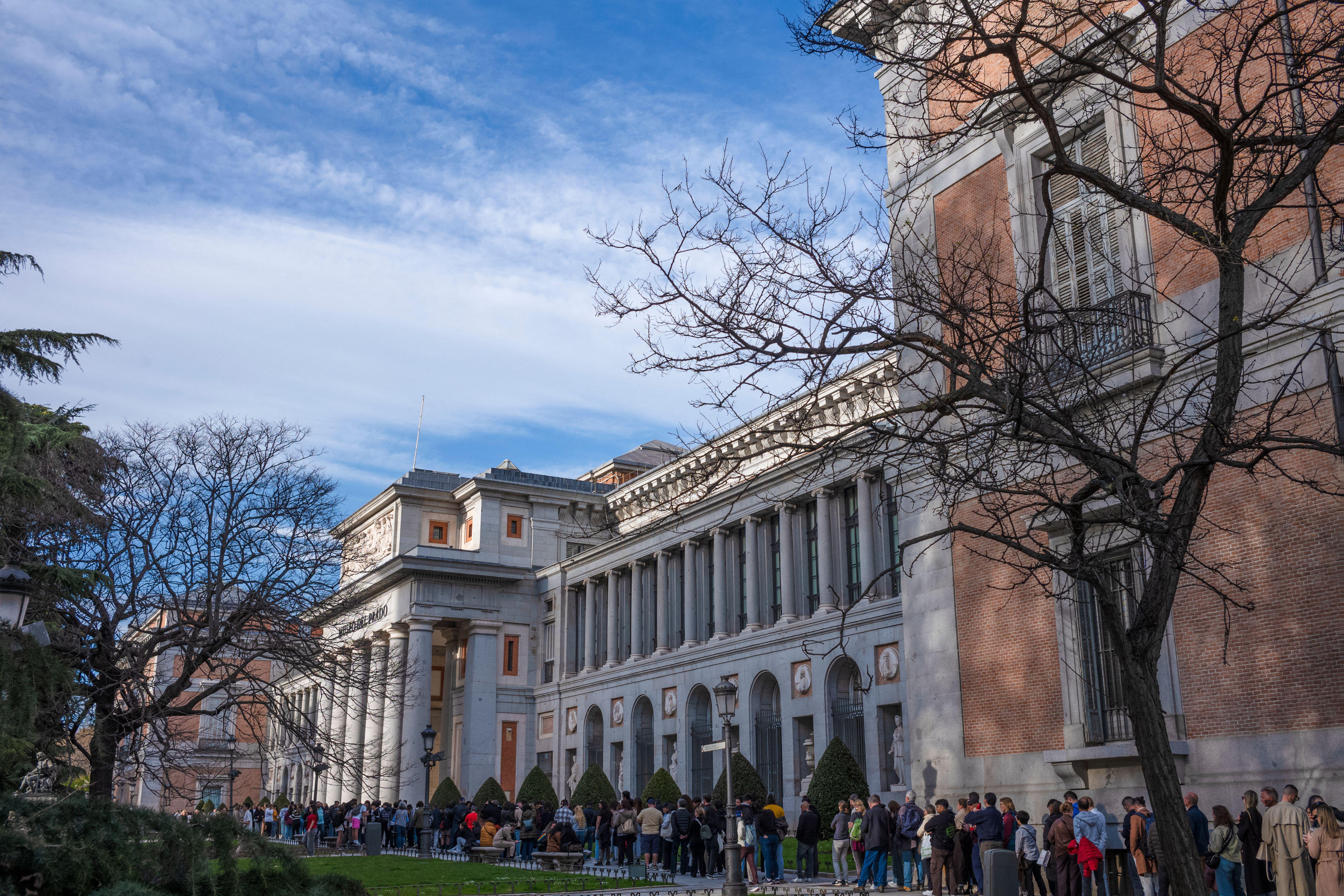 Long queue of people outside the Museo del Prado art gallery in Madrid, Spain.