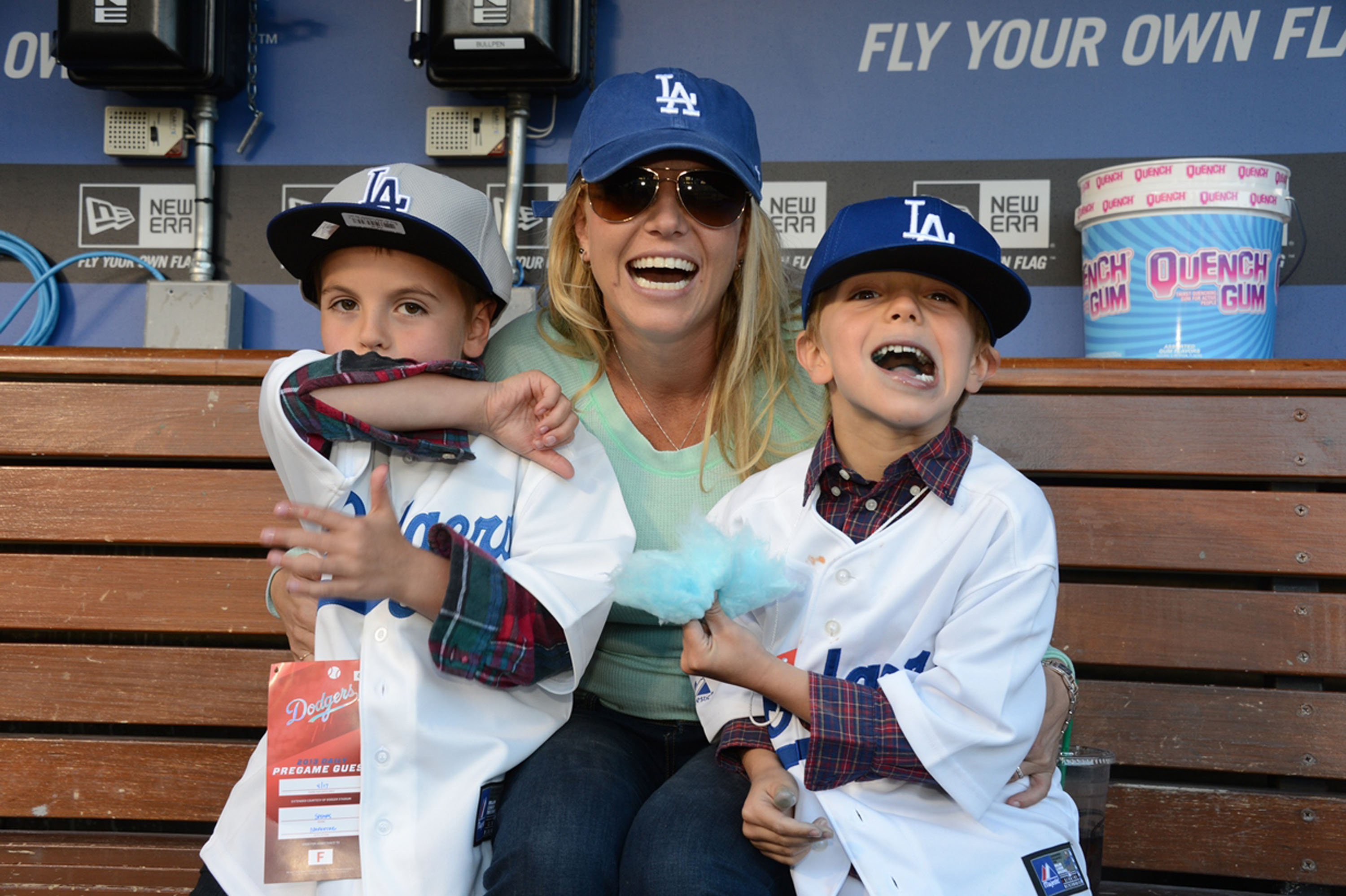 Britney Spears smiling with her two sons, Sean Preston and Jayden James Federline, at Dodger Stadium.