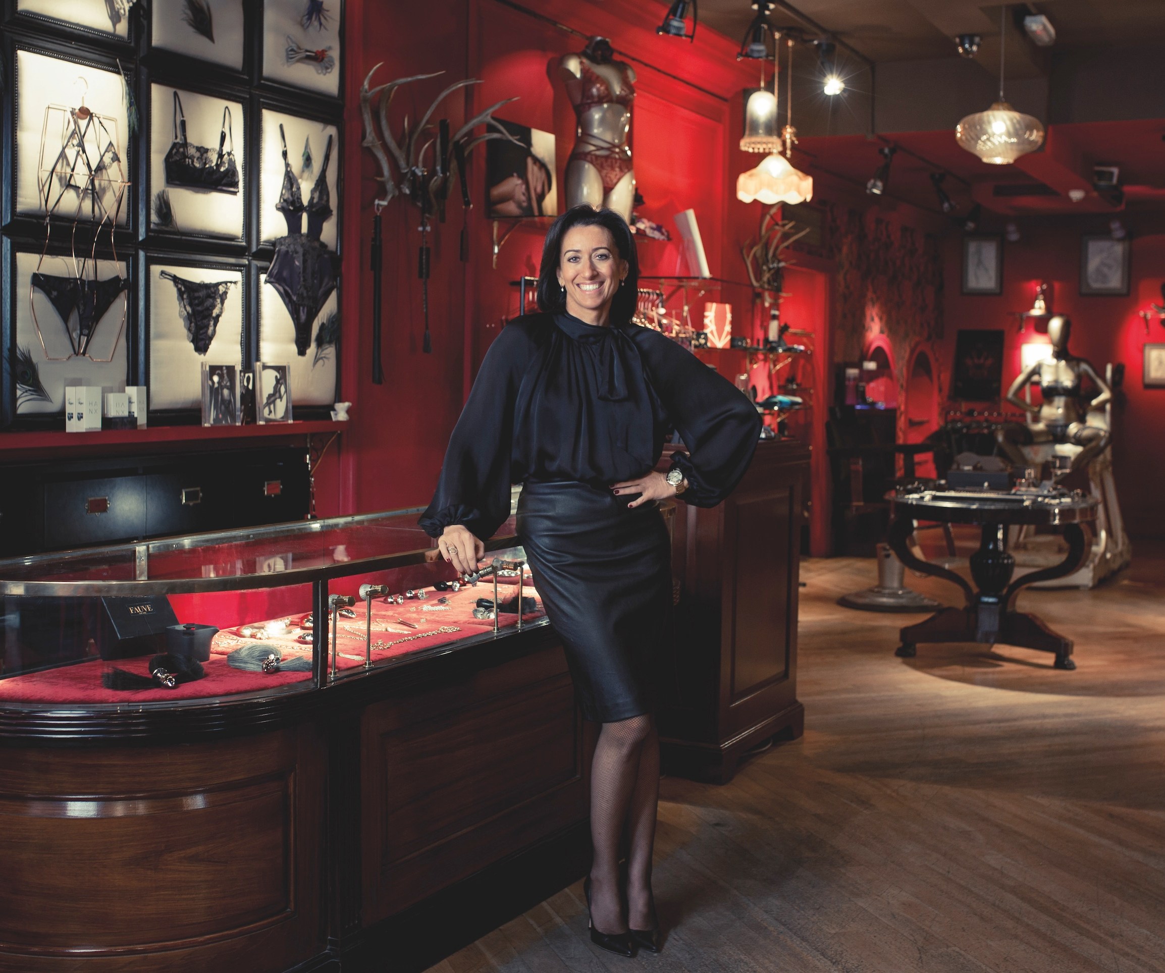 Lucy Litwack standing in a luxury lingerie and adult accessory boutique.