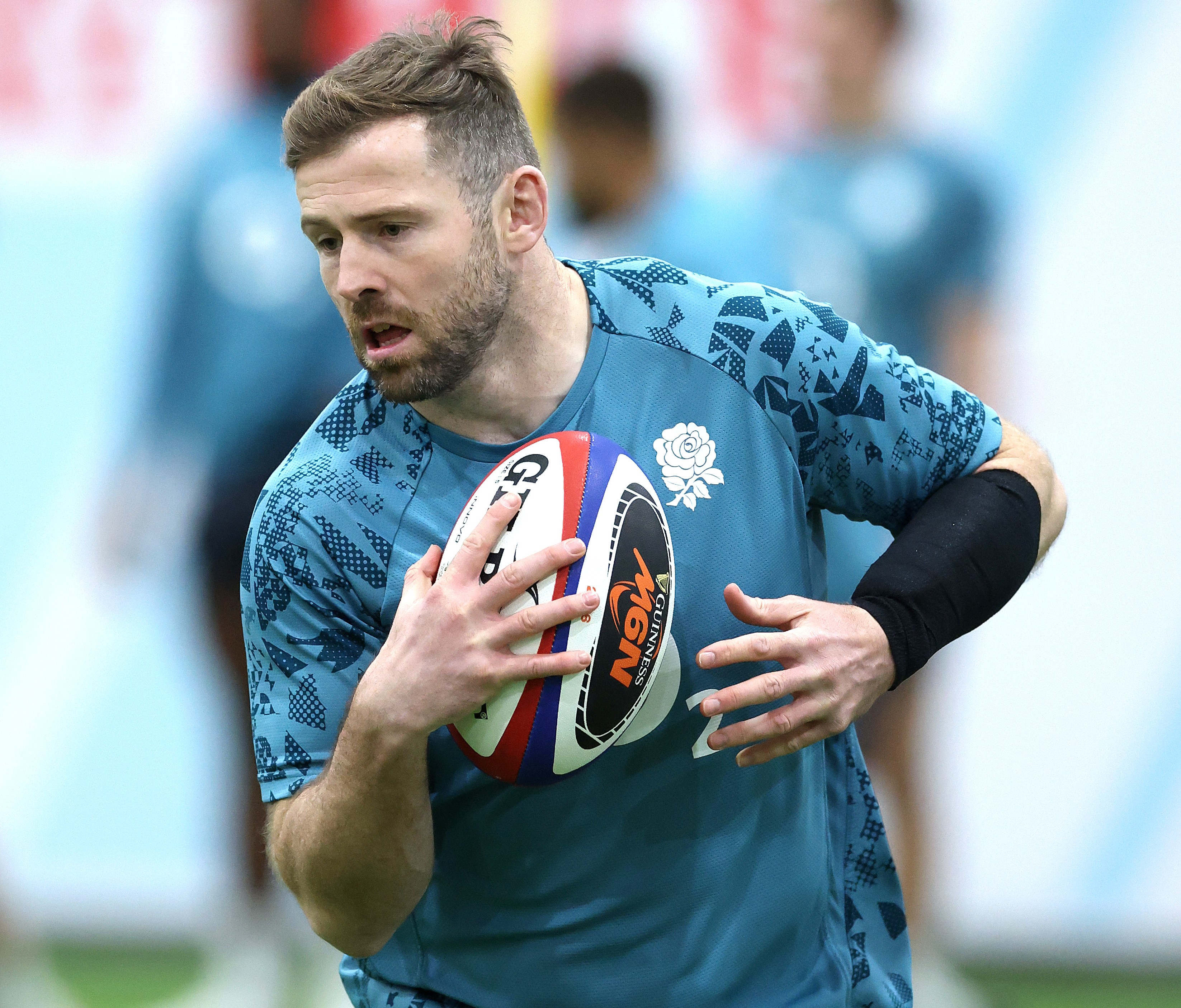 Elliot Daly running with the ball during an England training session.