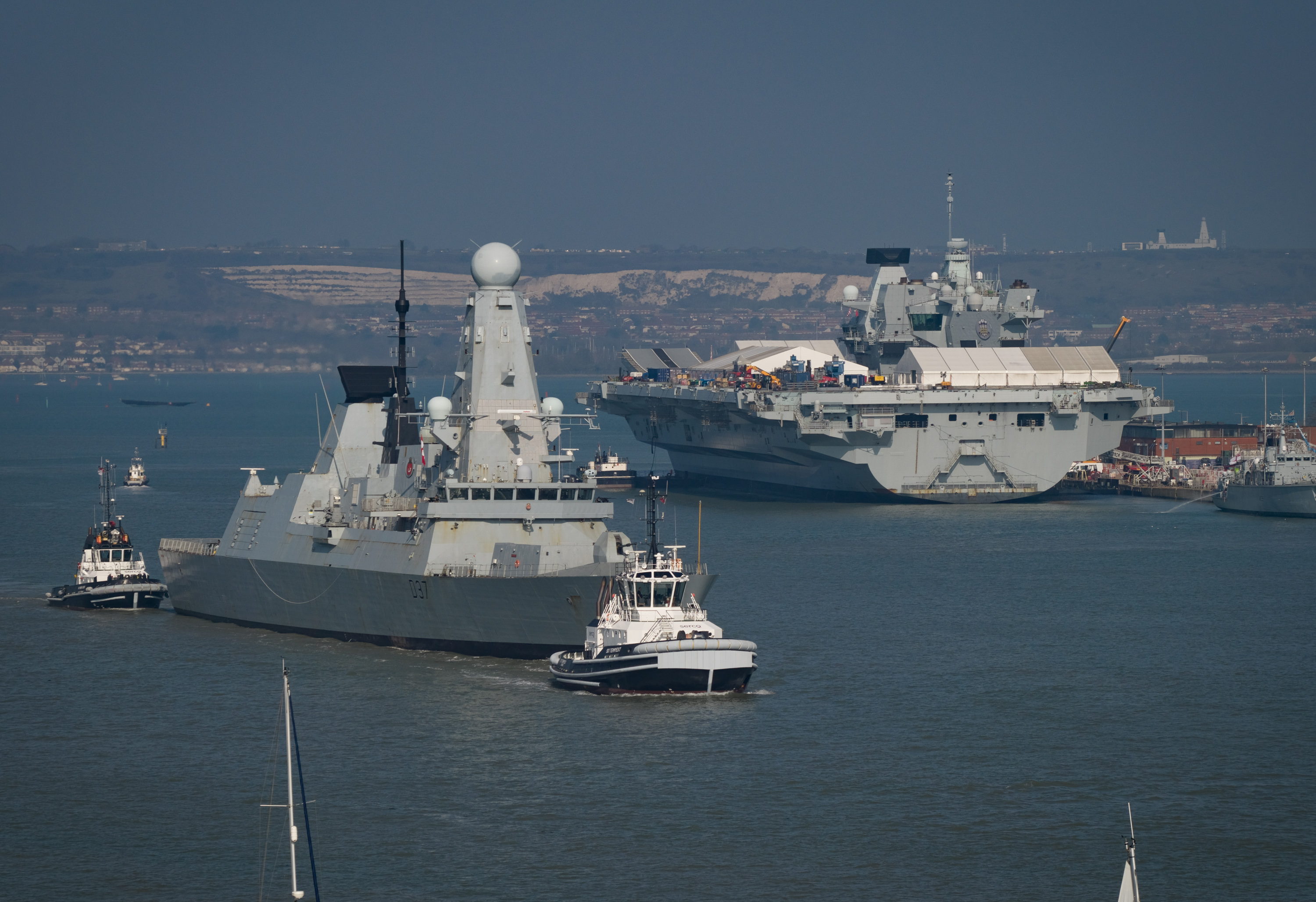 HMS Duncan leaving Portsmouth Harbour, passing HMS Prince of Wales.