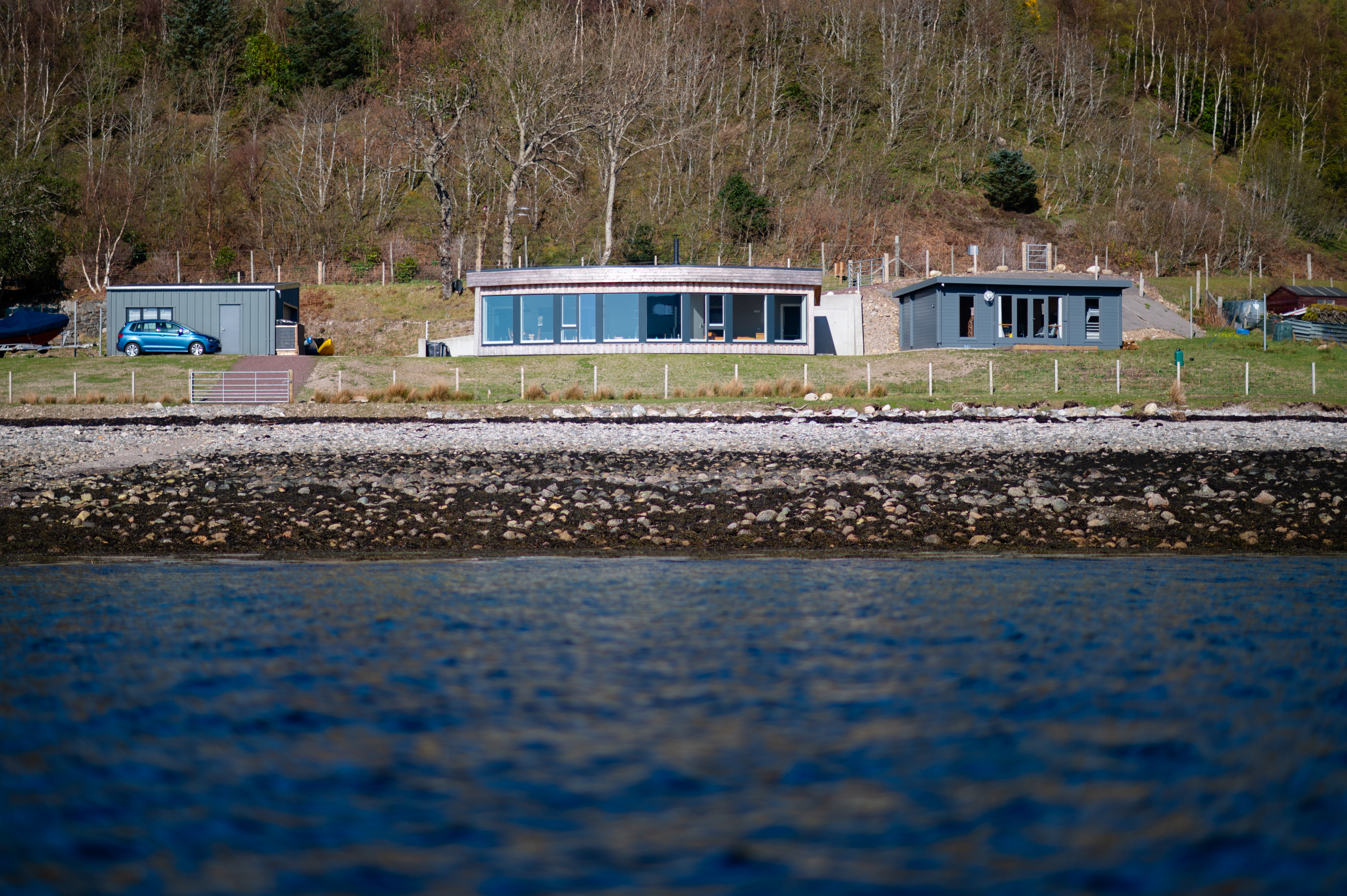 Loch Carron with modern housing on the shore.