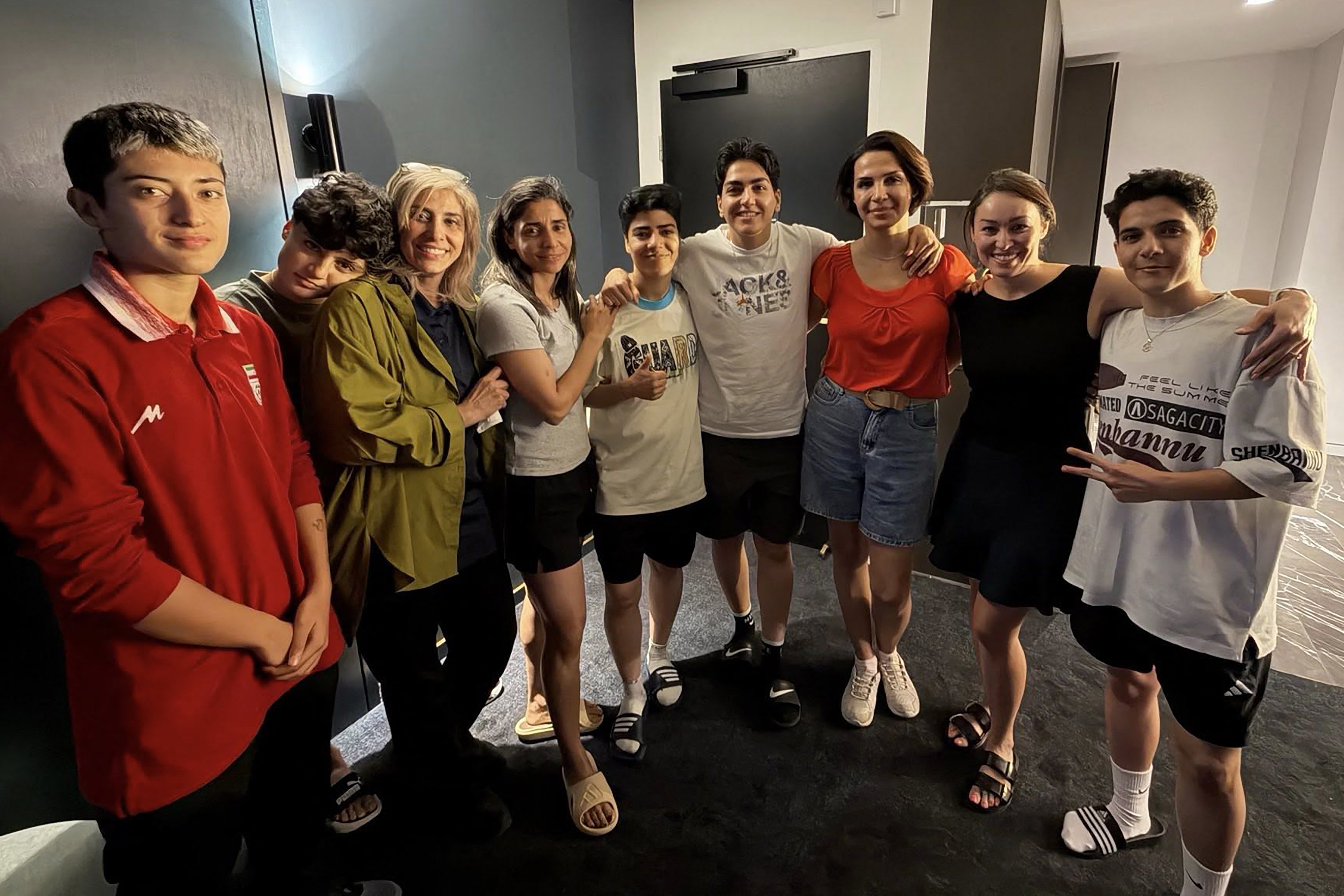 Six Iranian football players, who are claiming asylum, a team official and two unidentified local officials