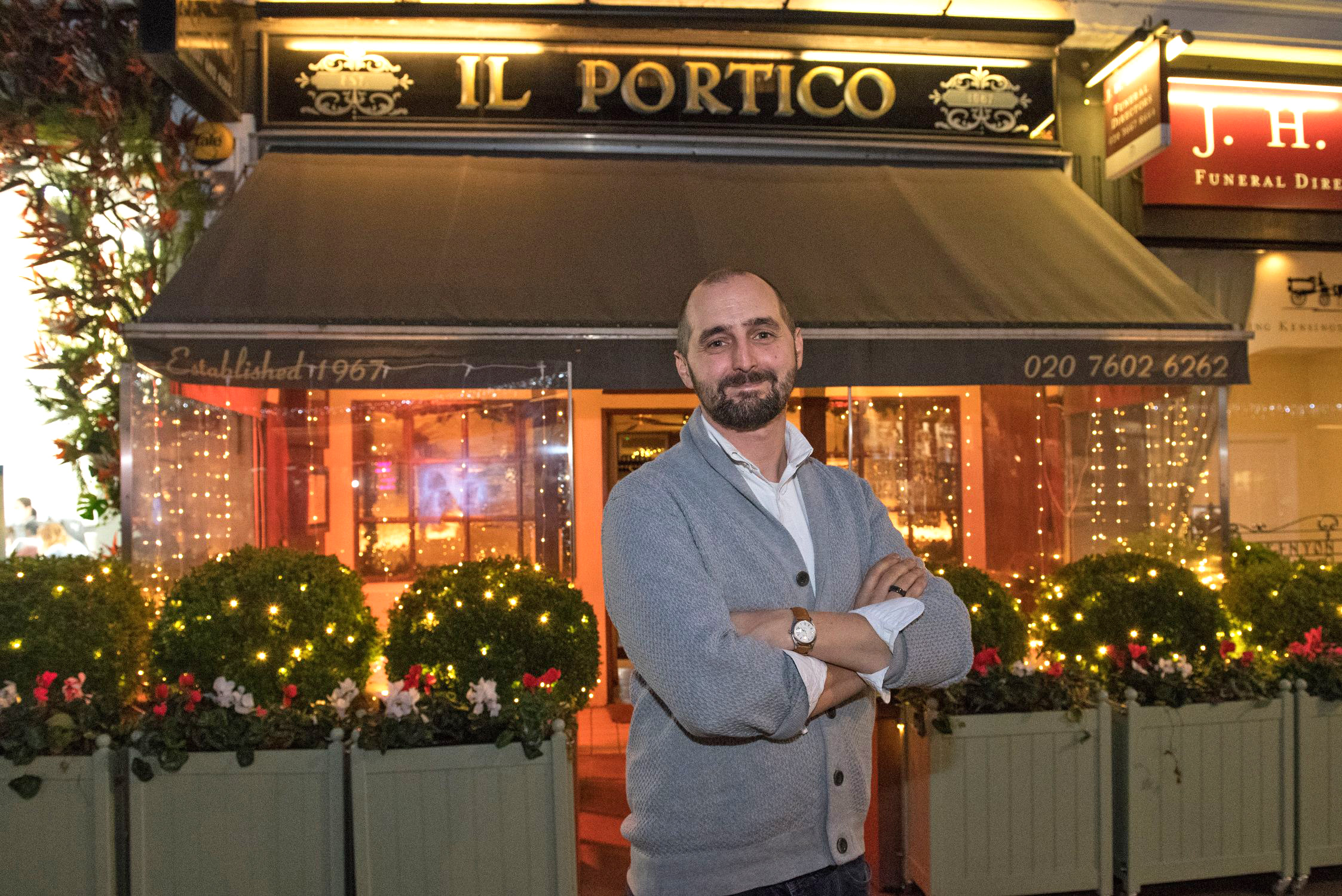 James Chiavarini, owner of Il Portico restaurant, stands outside his establishment.