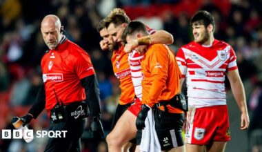 Jacob Host is helped from the field during St Helens' win over Bradford