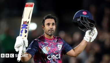 Ravi Bopara with his bat aloft in his right hand and his helmet in his left after scoring a century for Northants against Surrey at The Oval