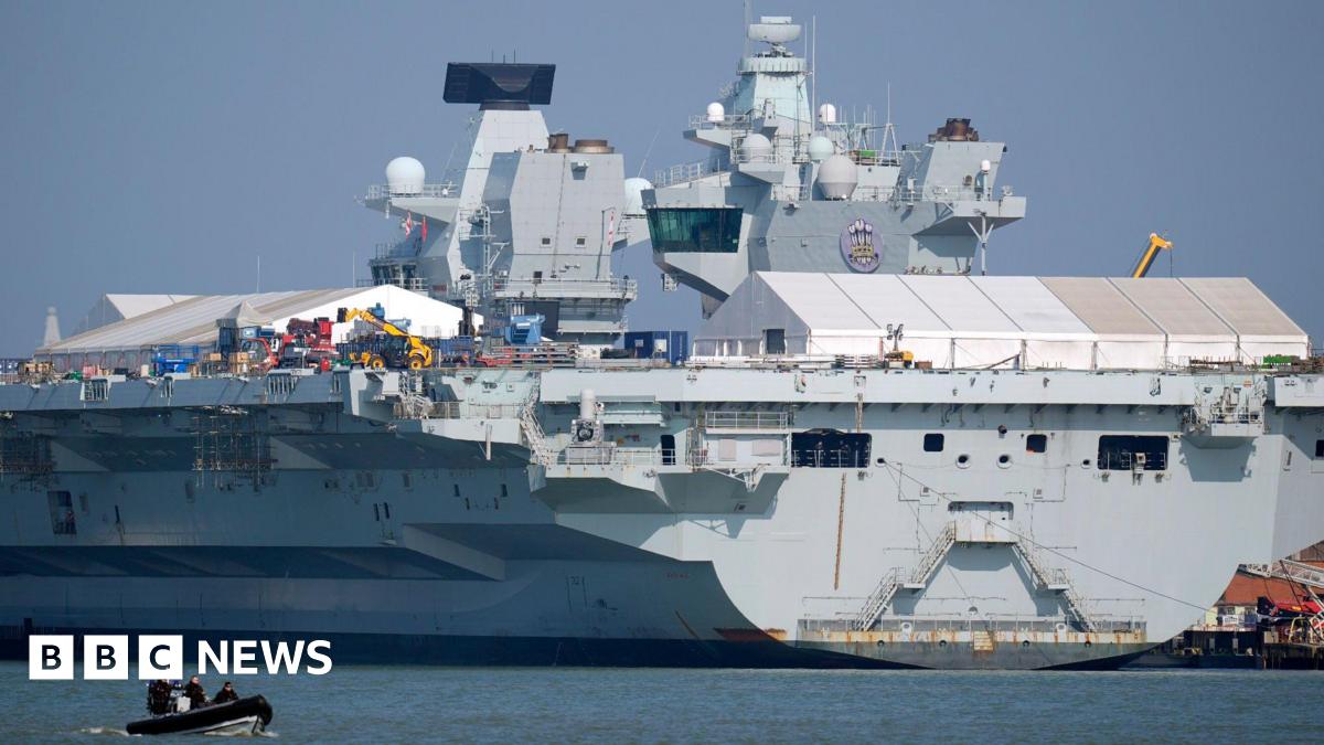 The Royal Navy aircraft carrier HMS Prince of Wales in dock at Portsmouth harbour, Hampshire.