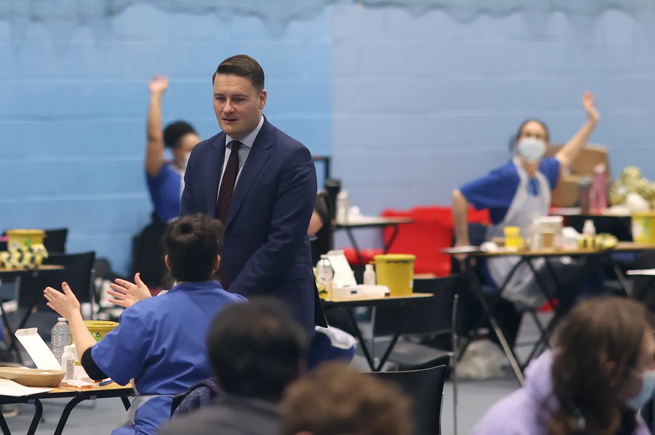 Wes Streeting observing students receive the Meningitis B vaccine at the University of Kent.